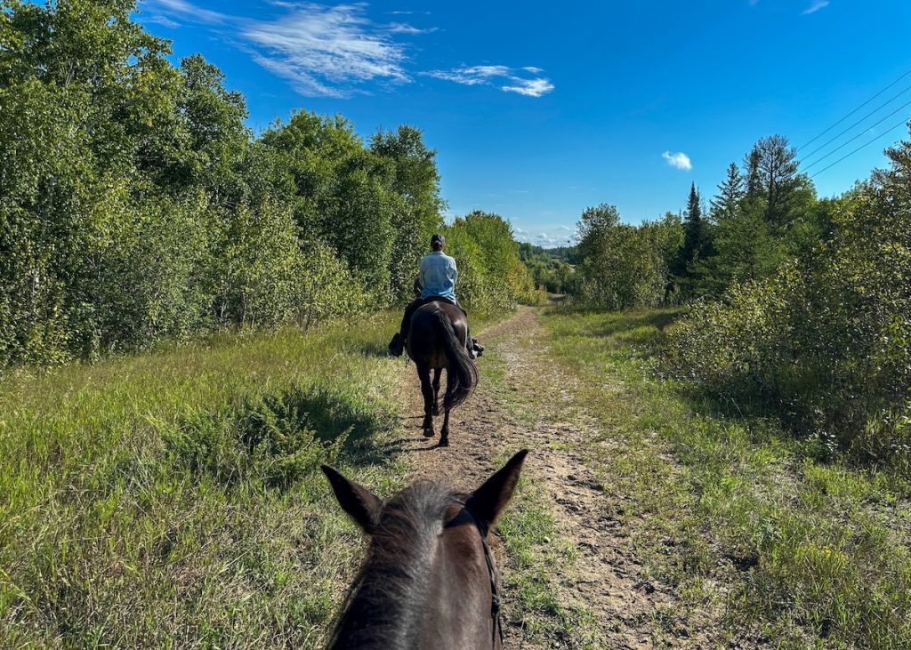 Horseback riding in Whiteshell Provincial Park.