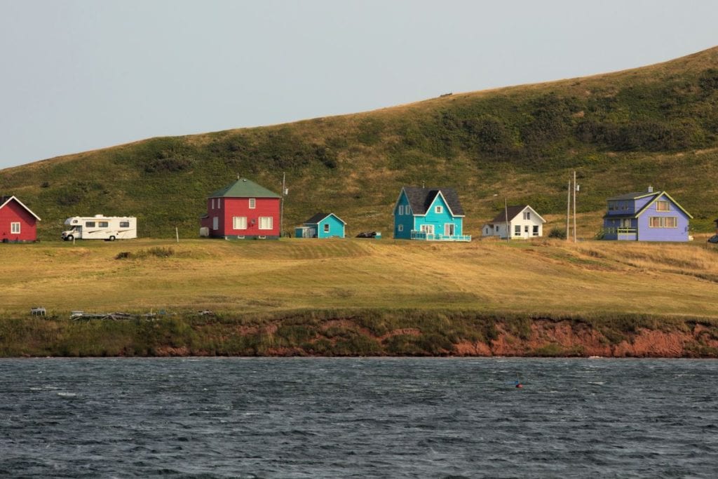 Colourful homes dot the landscape of the Magdalen Islands.