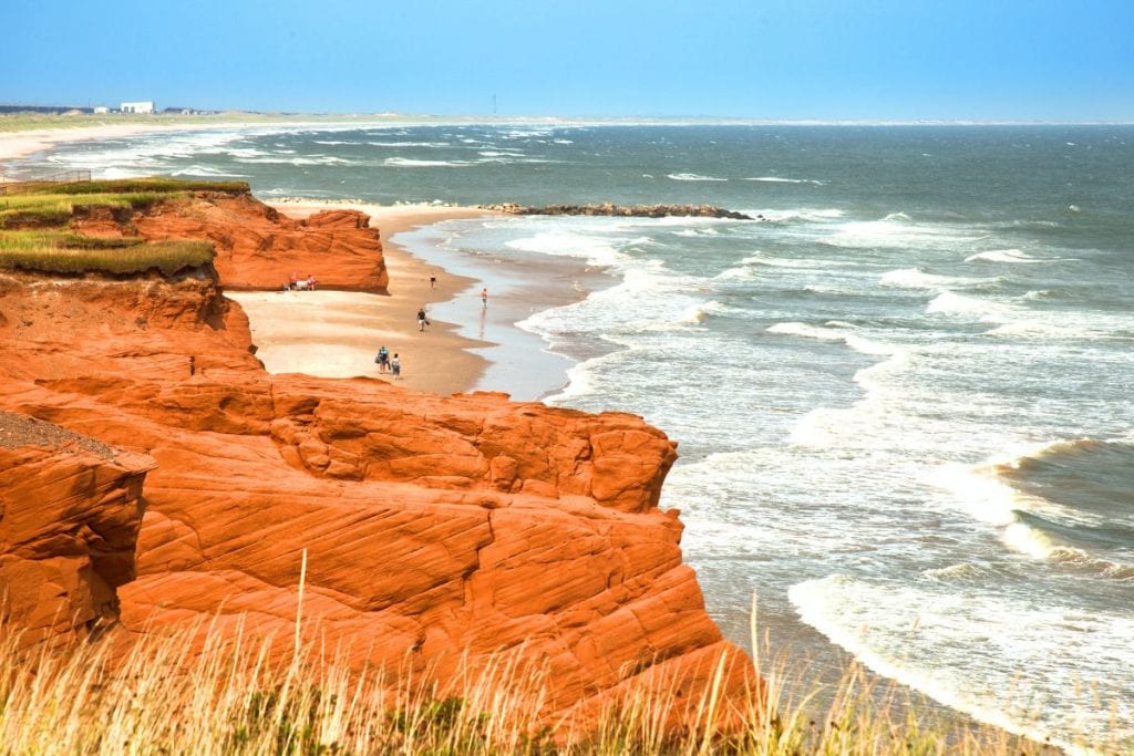 Admiring the red cliffs of the Magdalen Islands, Quebec.