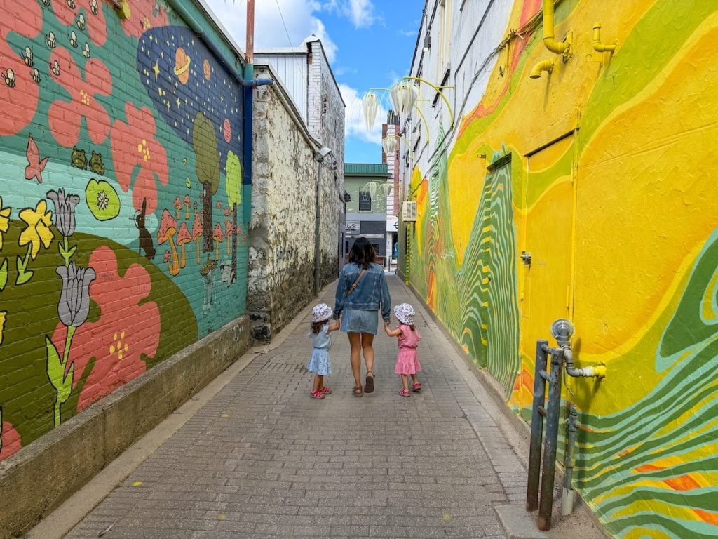 Walking through a colourful alley in downtown North Bay.