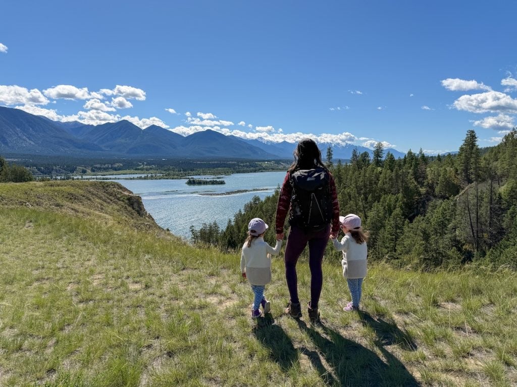 Standing with our twin toddlers to admire the beauty of BC's Columbia Valley from the Wilmer Wetland Hike.